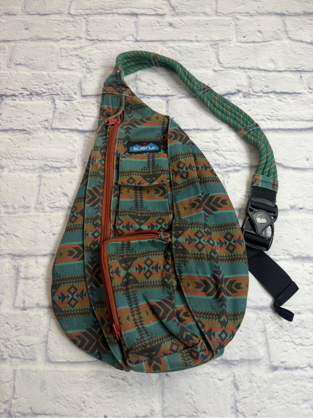 Kavu Green & Brown Patterned Sling Bag with Orange Accents